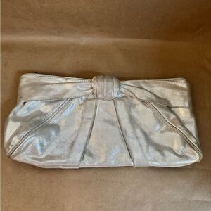 Kooba Silver Metallic Leather Clutch with Silver Coloured Hardware. 12.5” by 5”